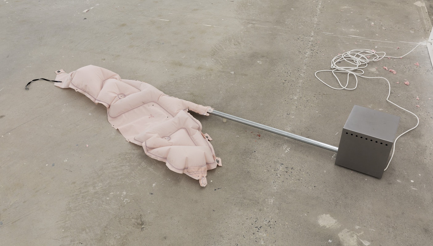 Alicia Frankovich, Blow up (deployed Tesla Air bag), 2023-24, installation view, And This Time the Well Is Alive, Gertrude Contemporary, Naarm Melbourne, 2024, deployed Tesla air bag, motor, timer, steel box, galvanised steel, image courtesy the artist and 1301SW, Naarm Melbourne and Sydney © the artist, photograph: Christian Capurro