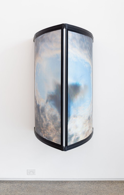 Chloe Nolan, Prisoner’s Cinema 2, 2024, installation view, The Limits of my Language are the Limits of my World, Gertrude Glasshouse, Naarm Melbourne, 2024, digital print on perforated vinyl, LED light, caravan awnings, image courtesy and © the artist, photograph: Christian Capurro