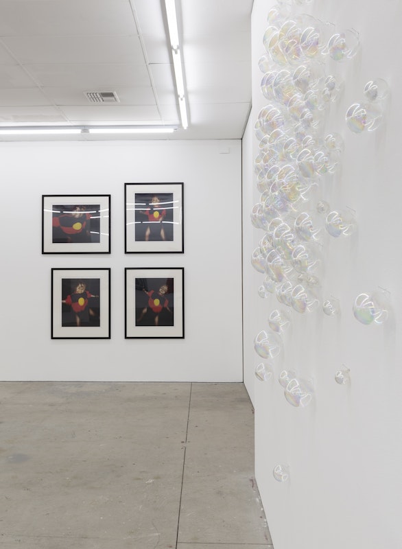 Destiny Deacon, Dance Little Lady (a), (b), (c), (d), 1994-2000, photographs; Nike Savvas, Nice Bubbles, 1994, iridescent blown glass, installation view, A Fictional Retrospective: Gertrude’s First Decade 1985–1995, Gertrude Contemporary, Naarm Melbourne, 2025, image courtesy and © the artists, photograph: Christian Capurro