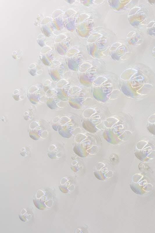 Nike Savvas, Nice Bubbles (detail), 1994, installation view, A Fictional Retrospective: Gertrude’s First Decade 1985–1995, Gertrude Contemporary, Naarm Melbourne, 2025, iridescent blown glass, image courtesy of the artist and Arc One Gallery, Naarm Melbourne © the artist, photograph: Christian Capurro