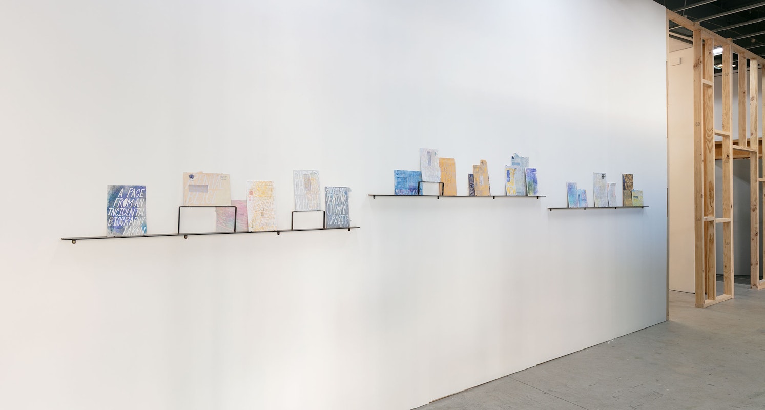 Raquel Ormella, A page from an incidental biography, 2024-25, , installation view, 1964, 1969, 1977, 1995, 2000, 2005, 2025, Gertrude Contemporary, Naarm Melbourne, 2025, recycled DL C4 and C5 envelopes, wax and oil coloured pencils, steel shelf, image courtesy the artist and Milani Gallery, Meanjin Brisbane © the artist, photograph: Christian Capurro.