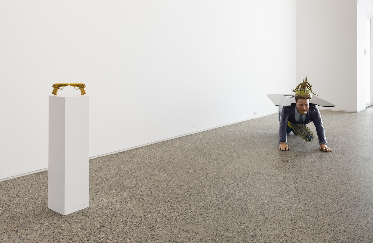 Chunxiao Qu, We Kissed, 2025, photopolymer resin, polished metallic gold finish, 30 x 10.8 x 2.2 cm; and Boyfriend Table, ABS polymer, steel, acrylic paint, plexiglass, glass, 215 x 86 x 84 cm, courtesy of the artist and FUTURES, Naarm Melbourne, installation view, Gertrude Glasshouse, Naarm Melbourne, 2025, photography: Christian Capurro