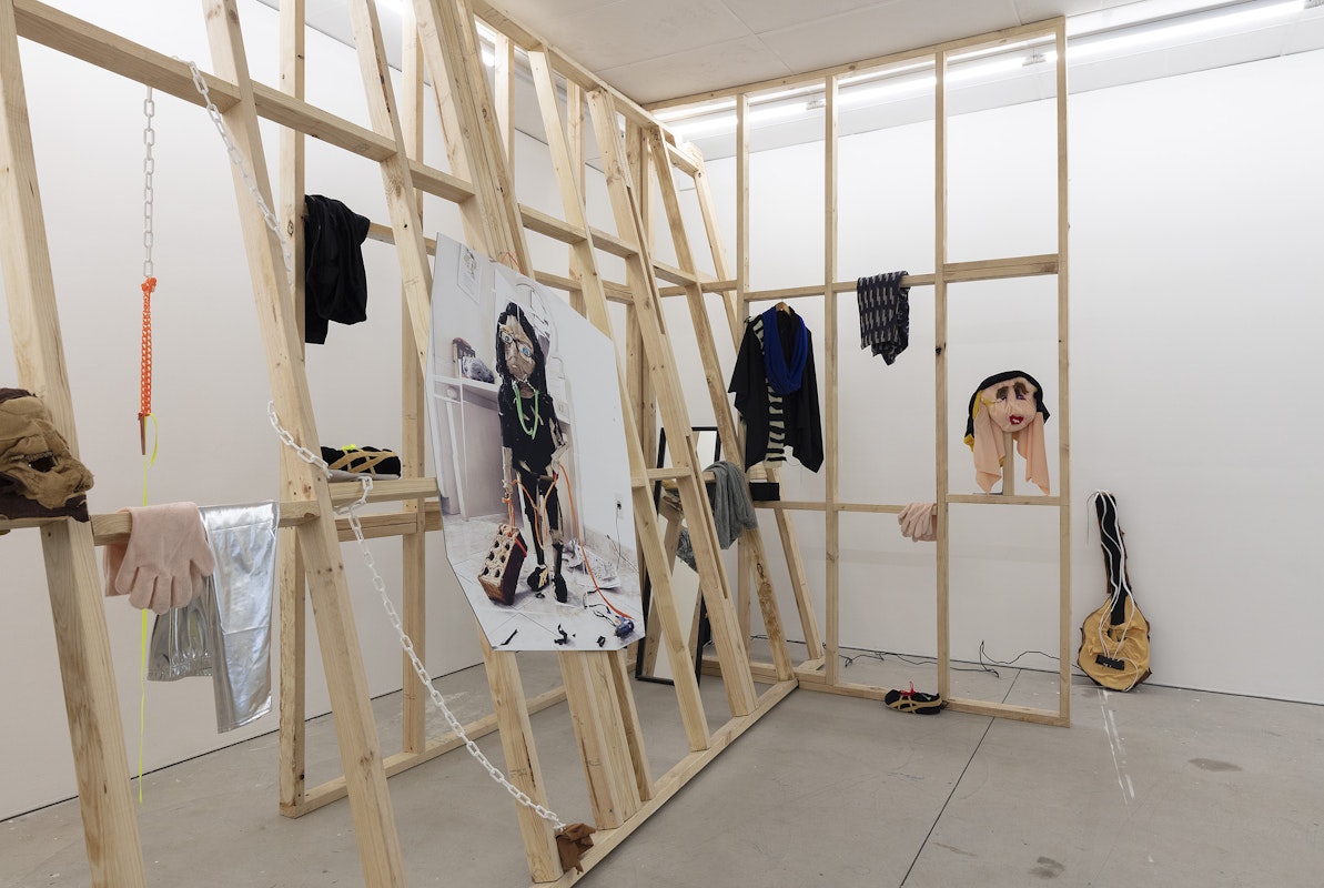 Ardi Gunawan, luckily there’s no inside (brick Muppet filth face anxiety ladder. Emotion traffic re-enactment Jakarta body) 2011/2025, installation view, Of Stadiums and Construction Sites (Ne change rien pour que tout soit différent), Gertrude Contemporary, Naarm Melbourne, 2025, performance, synthetic fur, foam, fabric, cardboard, found objects, digital print mounted on kappa board, timber structures repurposed from previous exhibition build, image courtesy the artist as ISA Gallery, Jakarta © the artist, photograph: Christian Capurro