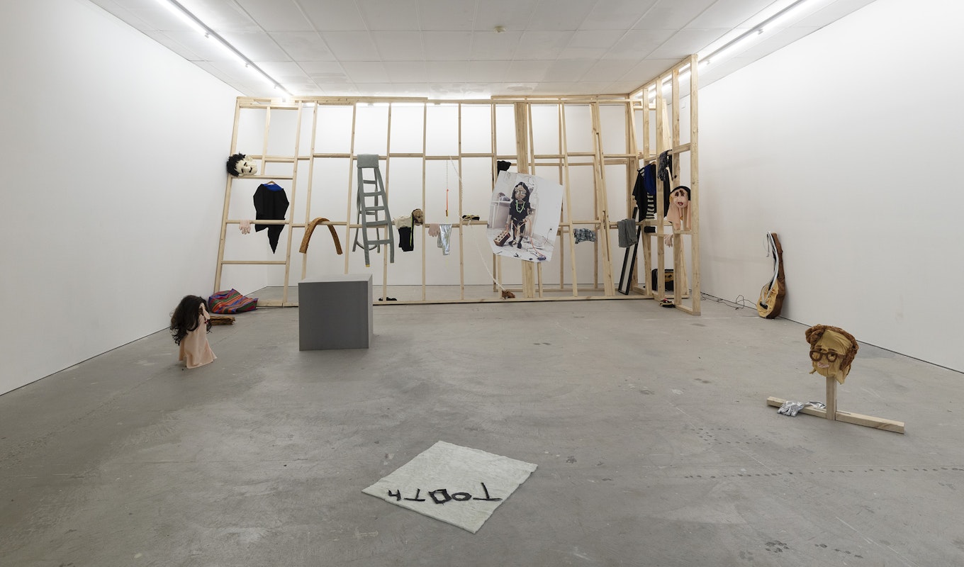 Ardi Gunawan, luckily there’s no inside (brick Muppet filth face anxiety ladder. Emotion traffic re-enactment Jakarta body) 2011/2025, installation view, Of Stadiums and Construction Sites (Ne change rien pour que tout soit différent), Gertrude Contemporary, Naarm Melbourne, 2025, performance, synthetic fur, foam, fabric, cardboard, found objects, digital print mounted on kappa board, timber structures repurposed from previous exhibition build, image courtesy the artist as ISA Gallery, Jakarta © the artist, photograph: Christian Capurro