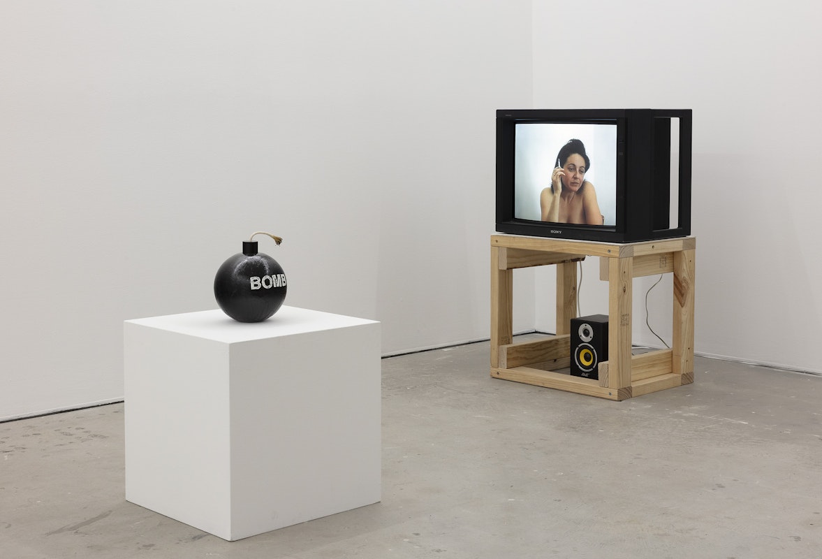 Joshua Petherick, Idol, 2011-2025, bouy, enamel, cord; A Constructed World, Where there’s smoke there’s a smoker, 2005, PAL video, installation view, Of Stadiums and Construction Sites (Ne change rien pour que tout soit différent), Gertrude Contemporary, Naarm Melbourne, 2025, image courtesy and © the artists, photograph: Christian Capurro