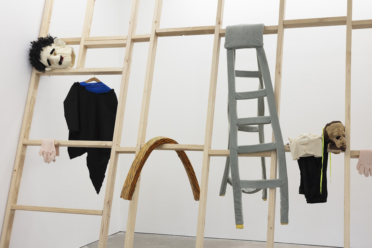 Ardi Gunawan, luckily there’s no inside (brick Muppet filth face anxiety ladder. Emotion traffic re-enactment Jakarta body) 2011/2025, installation view, Of Stadiums and Construction Sites (Ne change rien pour que tout soit différent), Gertrude Contemporary, Naarm Melbourne, 2025, performance, synthetic fur, foam, fabric, cardboard, found objects, digital print mounted on kappa board, timber structures repurposed from previous exhibition build, image courtesy the artist as ISA Gallery, Jakarta © the artist, photograph: Christian Capurro