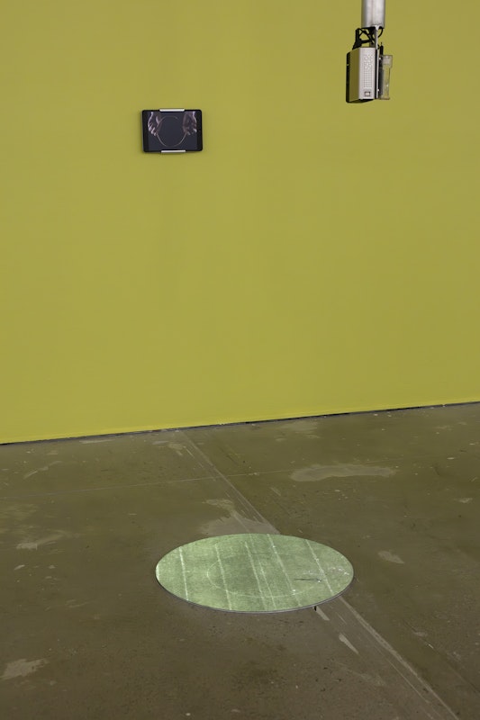 Aaron Rees, Telechiric Loop, 2015, installation view, installation view, Of Stadiums and Construction Sites (Ne change rien pour que tout soit différent), Gertrude Contemporary, Naarm Melbourne, 2025, HD projection onto acrylic, video on monitor, image courtesy and © the artist, photograph: Christian Capurro