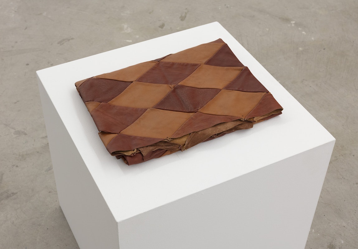 Ash Kilmartin, Remnant from The Travelling Mime II 2011, installation view, Of Stadiums and Construction Sites (Ne change rien pour que tout soit différent), Gertrude Contemporary, Naarm Melbourne, 2025, leather, image courtesy and © the artist, photograph: Christian Capurro