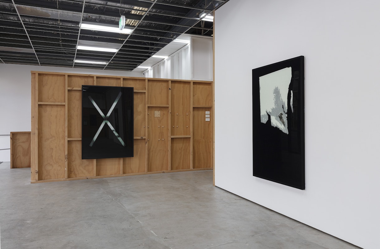 Foster Berean, Untitled from the series Low Expectations 2008, installation view, Of Stadiums and Construction Sites (Ne change rien pour que tout soit différent), Gertrude Contemporary, Naarm Melbourne, 2025, enamel and paper on glass, image courtesy and © the artists, photograph: Christian Capurro