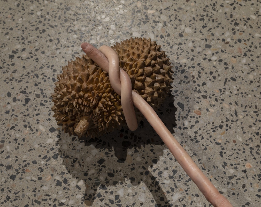 Nathan Beard, Cicerone (detail), 2025, installation view, Cicerone, Gertrude Glasshouse, Naarm Melbourne, 2025, painted silicone, steel, foam, 3D printed polylactic acid, 3D printed resin, alleged Ayutthaya period bronze, Gucci ‘Siam Glitter’ platform sandals, Siam Shimmer Swarovski Elements, Light Siam AB Swarovski Elements, Resene ‘Siam’, Little Greene ‘Thai Sapphire’, plastic orchid, acrylic nails, image courtesy the artist and FUTURES, Naarm Melbourne © the artist, photograph: Christian Capurro