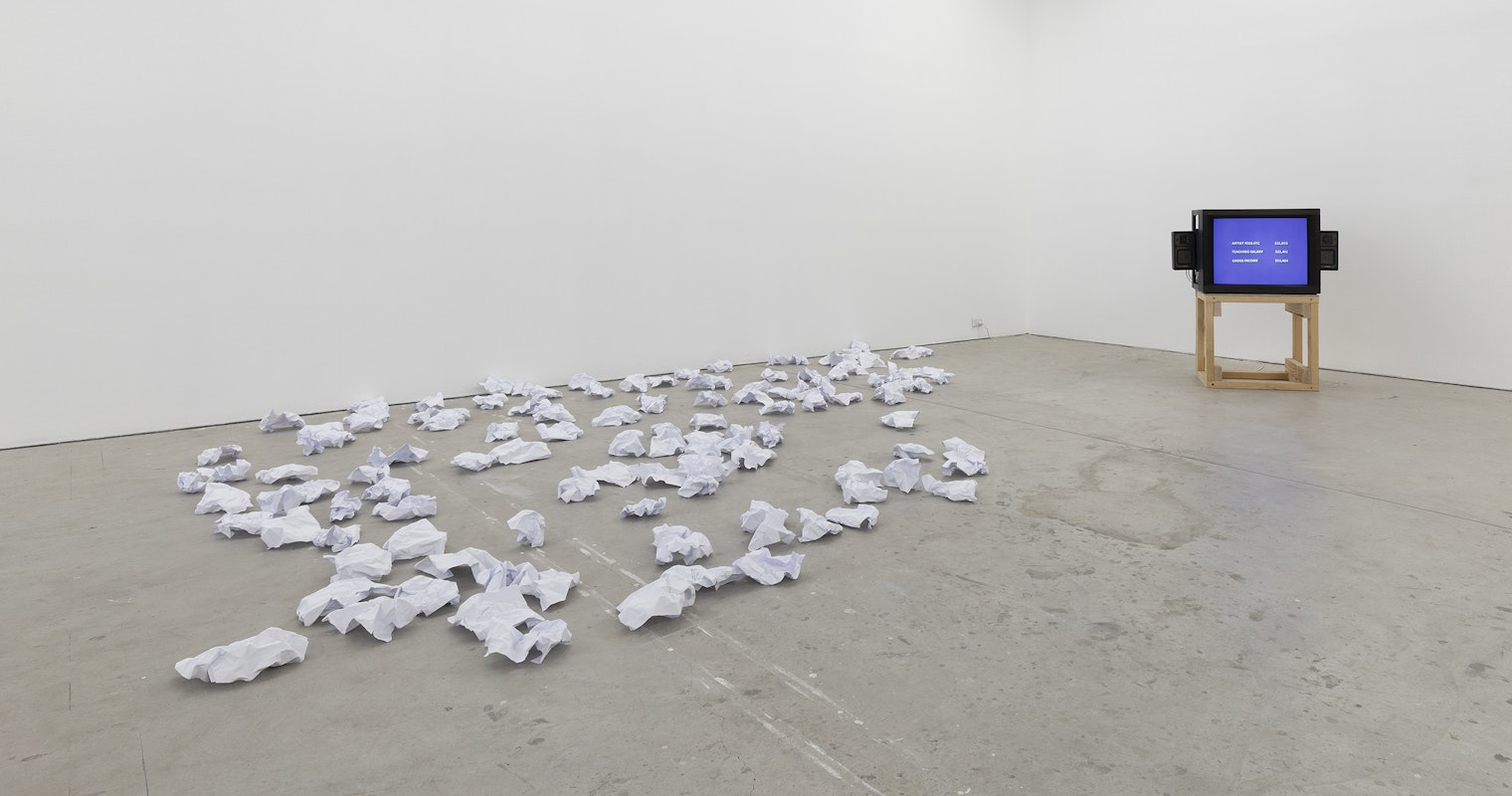 Michael Kennedy, /////131;;, 2025, scrunched paper; Steven Rhall, Financial Disclosure, 2020, single channel video, colour, sound, installation view, Bureaucracy of Feelings, Gertrude Contemporary, Naarm Melbourne, 2025, image courtesy and © the artists, photograph: Christian Capurro