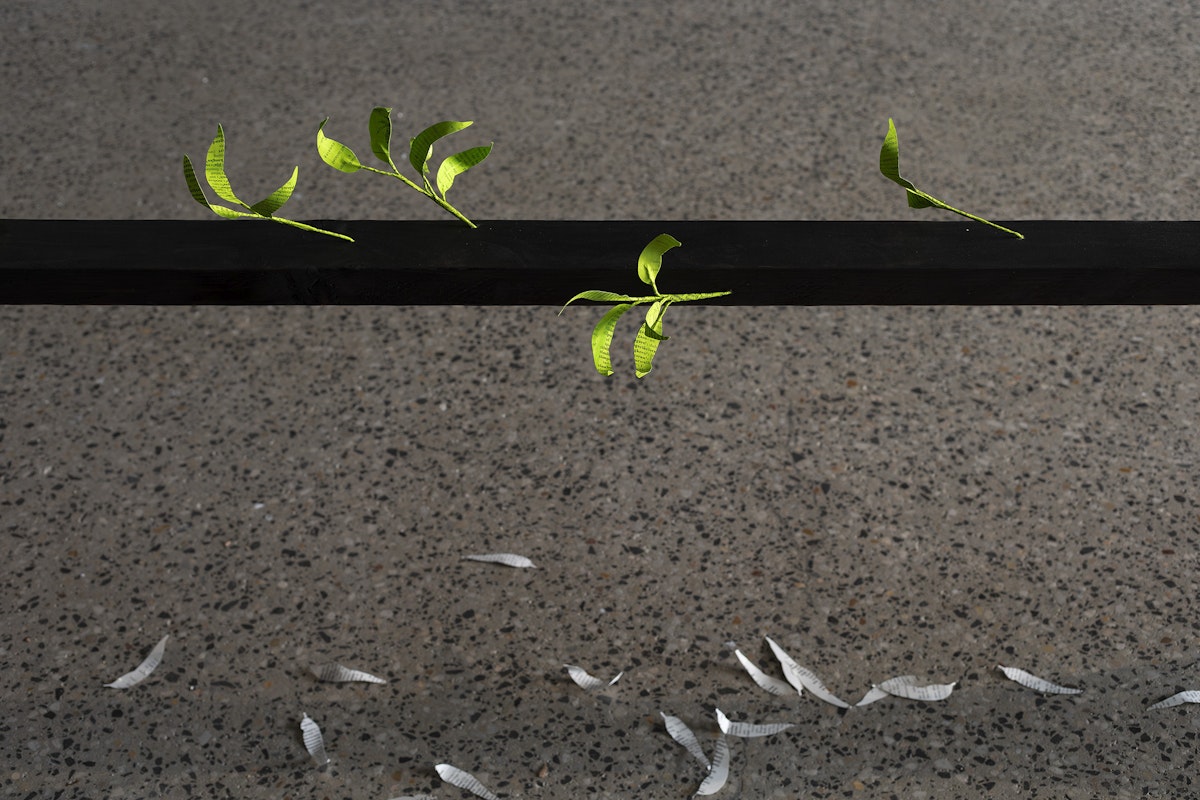 Jenna Lee, Burn before reading (detail), 2025, pages of Aboriginal Words and Place Names, calligraphy ink, florist wire, glue; Loose leaf (litter) (detail), 2025, pages of Aboriginal Words and Place Names, installation view, Burn Before Reading, Gertrude Glasshouse, Naarm Melbourne, 2025, image courtesy of the artist and MARS Gallery, Naarm Melbourne © the artist, photograph: Christian Capurro
