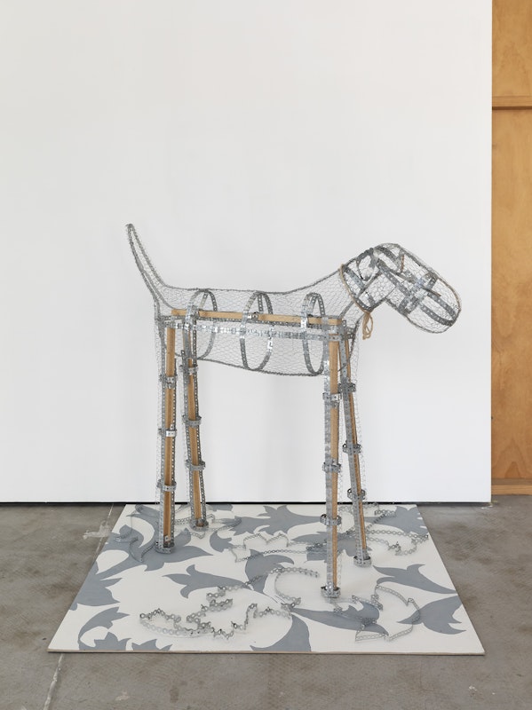 Grace Culley, Checky Dog in the Family Room, 2025, installation view, Various Small Fires, Gertrude Contemporary, Naarm Melbourne, 2025, recycled timber, screws, steel wire, steel fixing band, steel flat brackets, twine, recycled MDF, house paint, shellac ink, biro, grey lead, image courtesy and © the artist, photograph: Christian Capurro