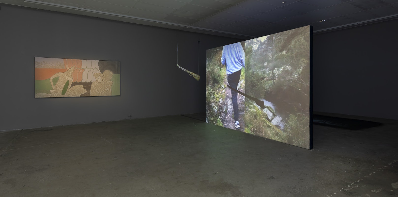 Tarik Ahlip, On Her Return (facial burns and a garland of flowers), 2025, plaster, pigment and sand; Gabi Briggs, GEDYURA, 2024, lomandra, wood, wire, single-channel video, colour, silent, installation view, Various Small Fires, Gertrude Contemporary, Naarm Melbourne, 2025, image courtesy and © the artists, photograph: Christian Capurro