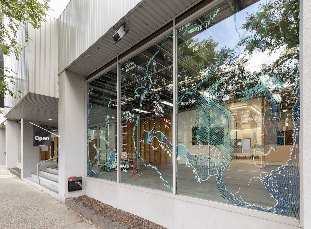 Renee Cosgrave in collaboration with Akuira, Amorangi, Jasmine Morrish, Rachel Boyd, Angela Cooper-Naresh, Anahera Neho-Cooper, Waru Cooper, Christo Crocker, Lisa Manawa Grocott, Helena Hapeta, Bronwyn Kara, Julien Te Purei Comer-Kleine, Errol MacKinven Hunt, Heneriata Paringatai, Watere Tahi, Irihipeti Waretini and our Kirrip (Bun Wurrung Balug), Ngā awa whina o te whakapapa (The braided rivers of whakapapa), 2025, installation view, Various Small Fires, Gertrude Contemporary, Naarm Melbourne, 2025, acrylic and chalk on window, image courtesy and © the artists, photograph: Christian Capurro
