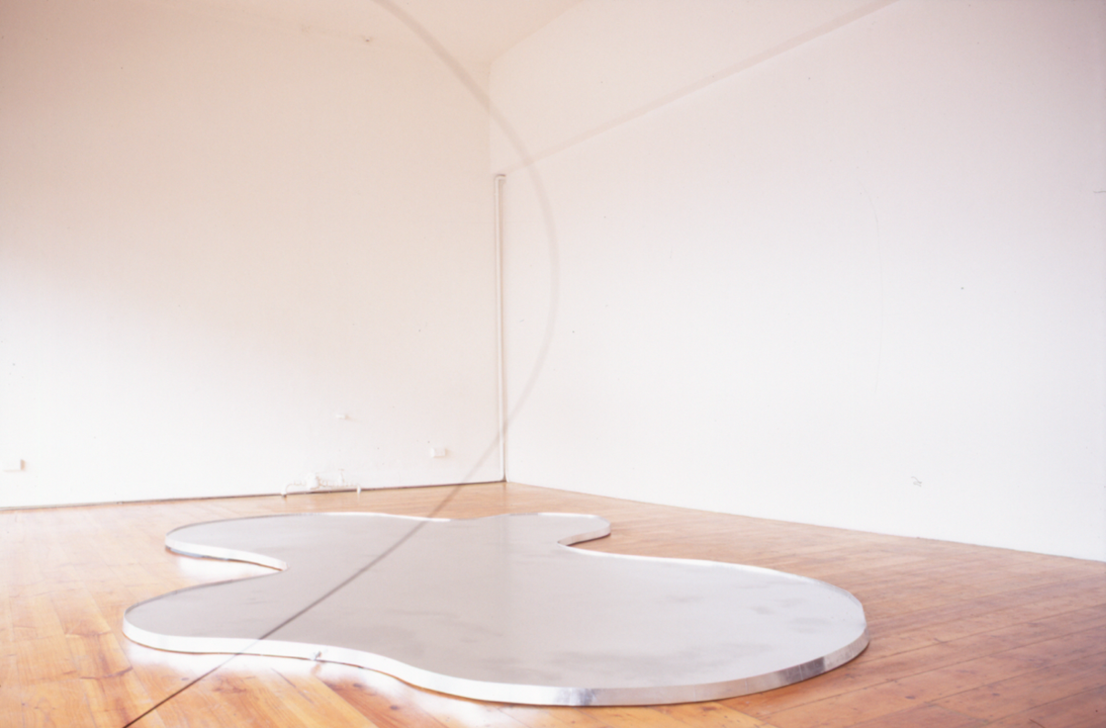 Lyndal Jefferies, Amorphous Pool, 1996, aluminium powder on oil on water. Photo courtesy of Gertrude Archive