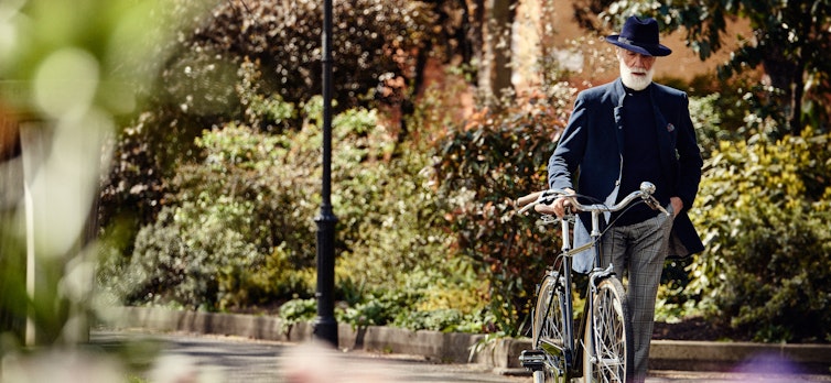 Gentleman walking with a bike
