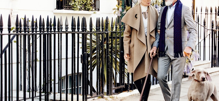 Couple and a dog walking through Chelsea