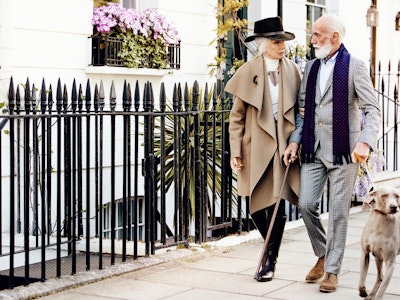 Couple and a dog walking through Chelsea