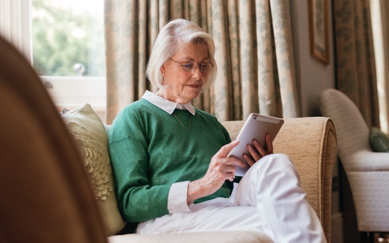 Lady looking at an iPad