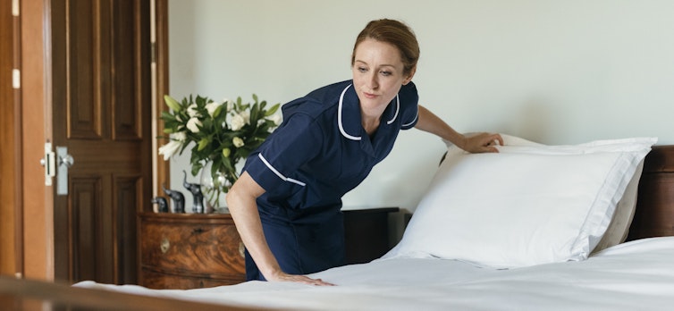 Carer making a bed
