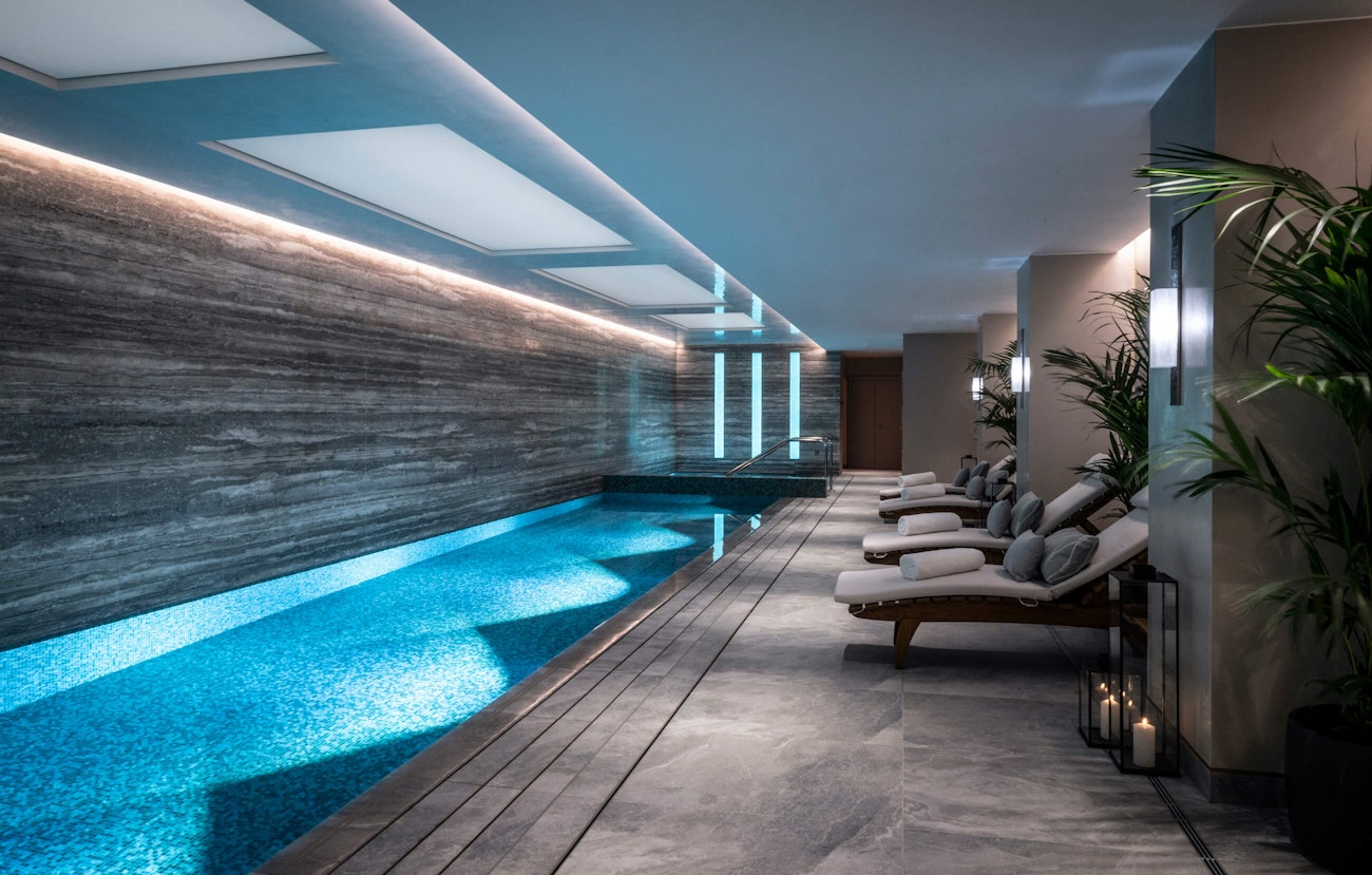 Indoor swimming pool with loungers