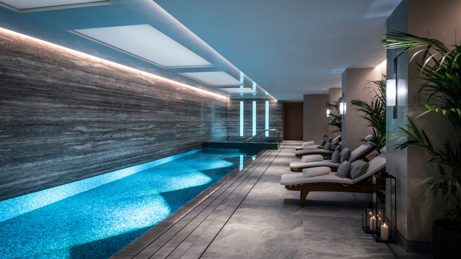 Indoor swimming pool with loungers