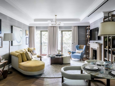 Furnished living room with seating area and dining table