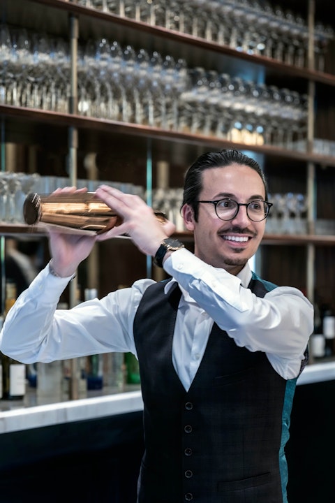 Bartender shaking cocktail