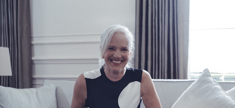 Smiling lady sitting on the sofa