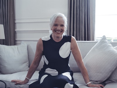 Smiling lady sitting on the sofa