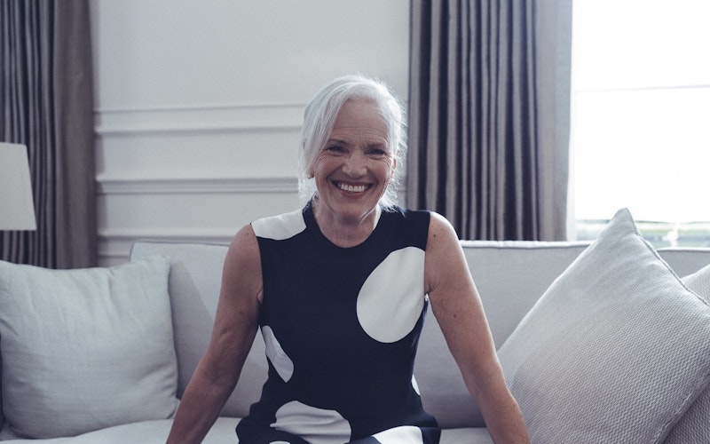 Smiling lady sitting on the sofa