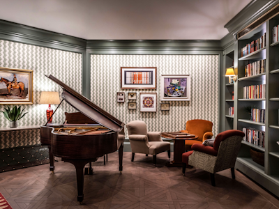 Baby grand piano in the library at Auriens Chelsea