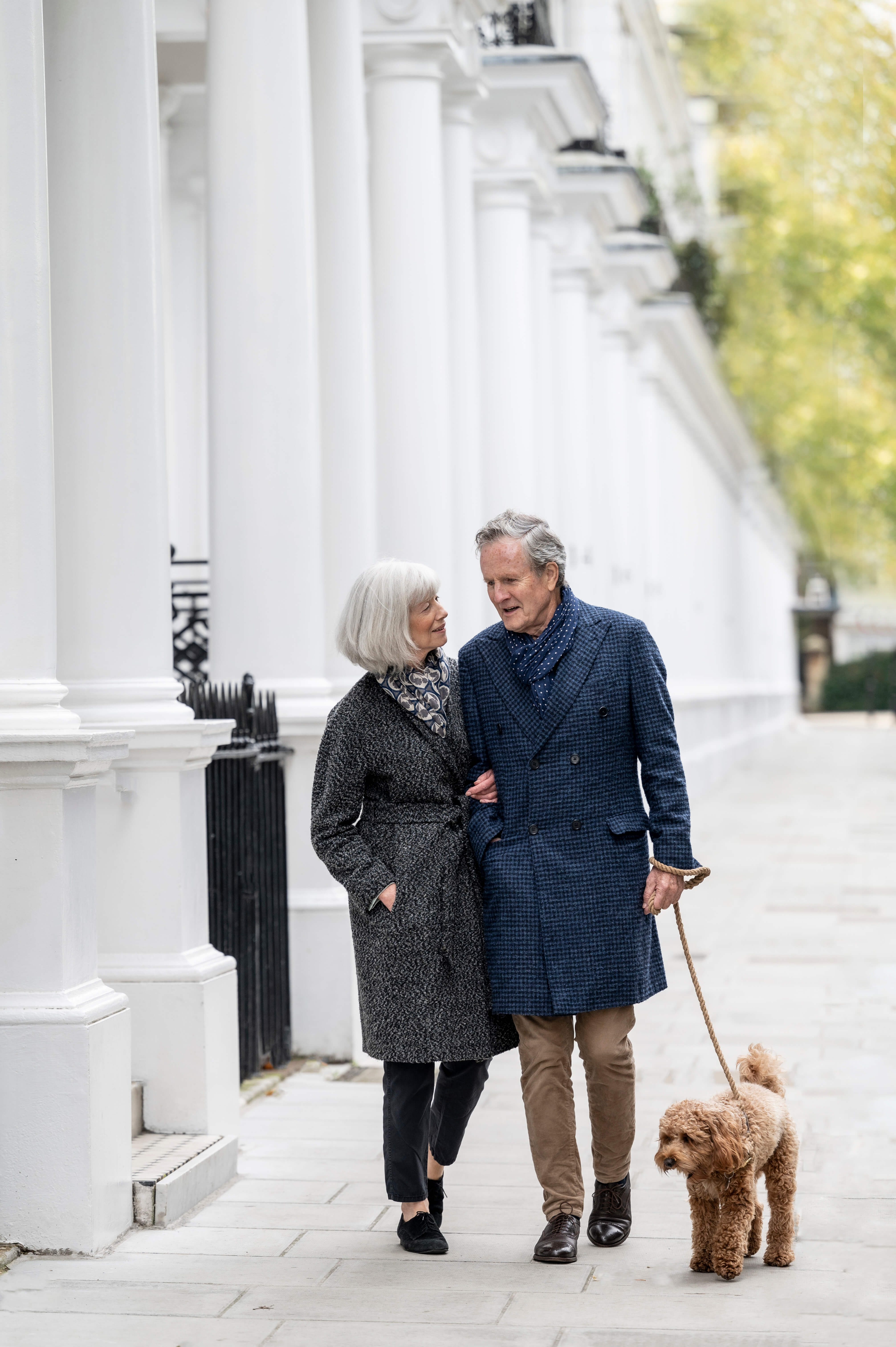Couple walking a dog in Chelsea