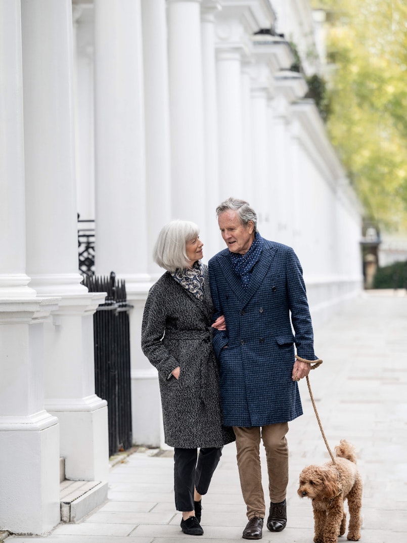Couple walking a dog in Chelsea
