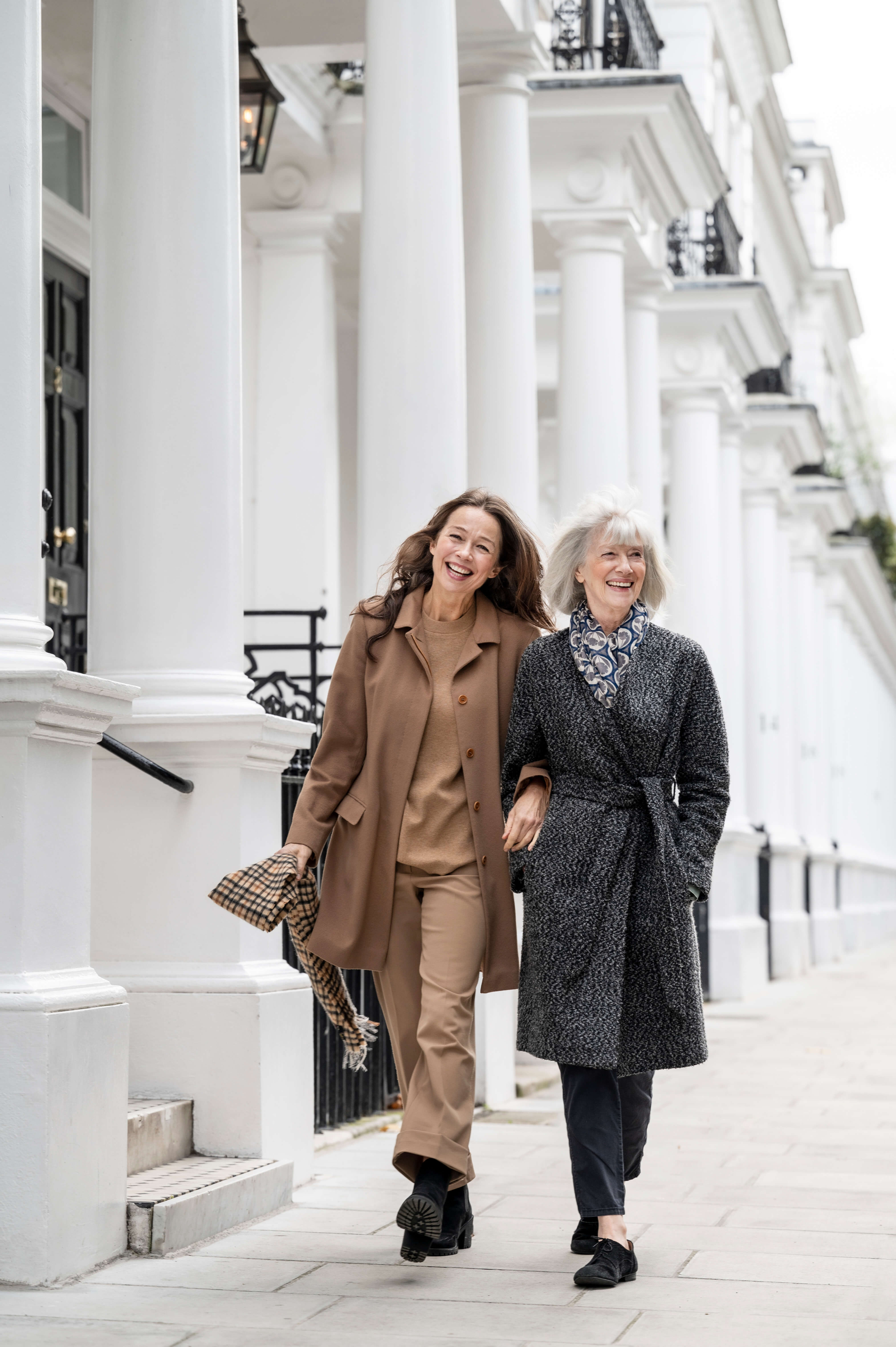 Moth and daughter walking through Chelsea