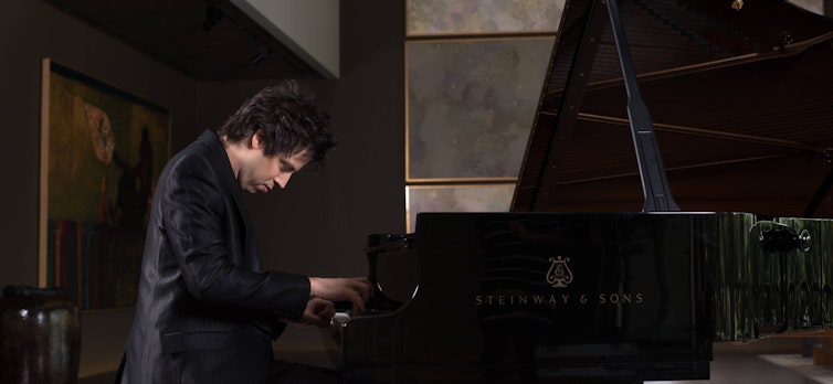 Pianist Dominic Ferris playing a Steinway piano