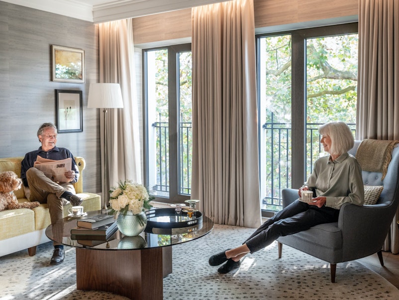 Couple relaxing in retirement apartment
