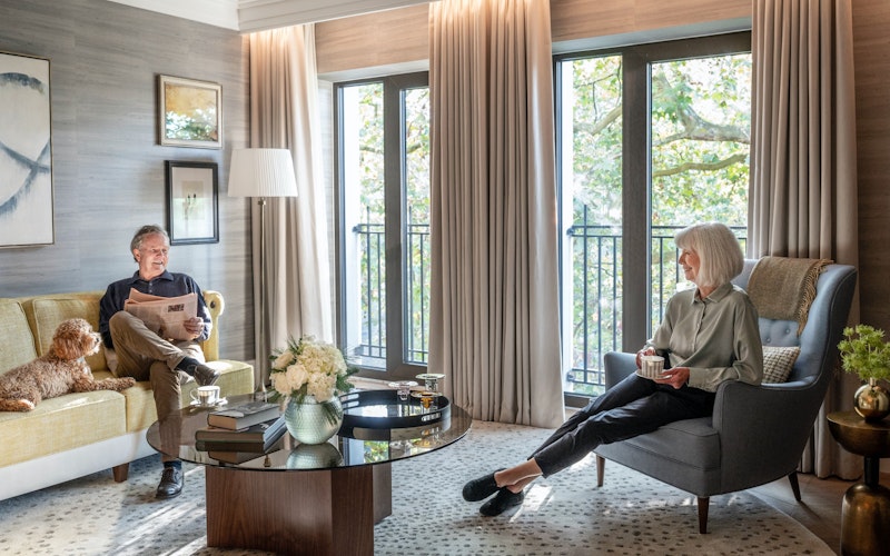 Couple relaxing in retirement apartment