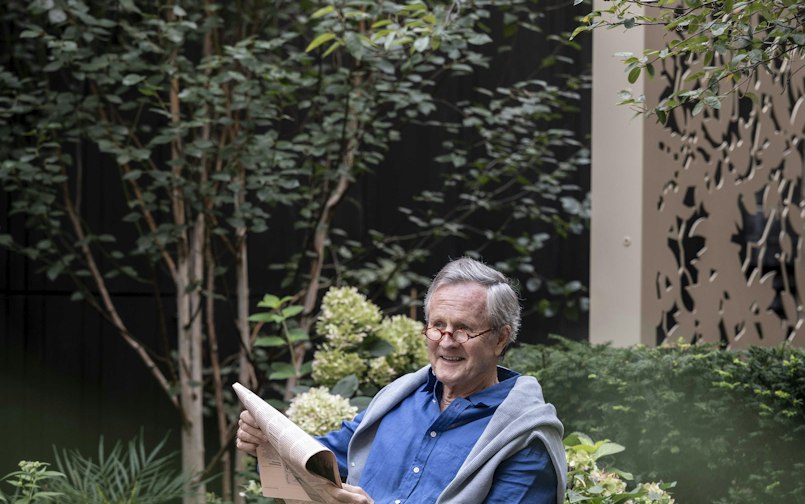 Reading a newspaper in the garden
