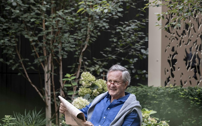 Reading a newspaper in the garden