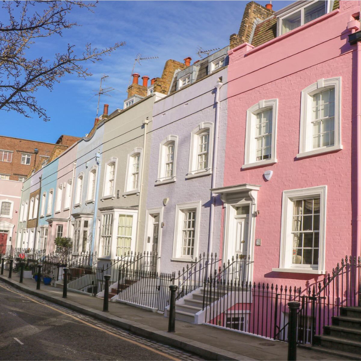 Pastel coloured houses on a street in Chelsea