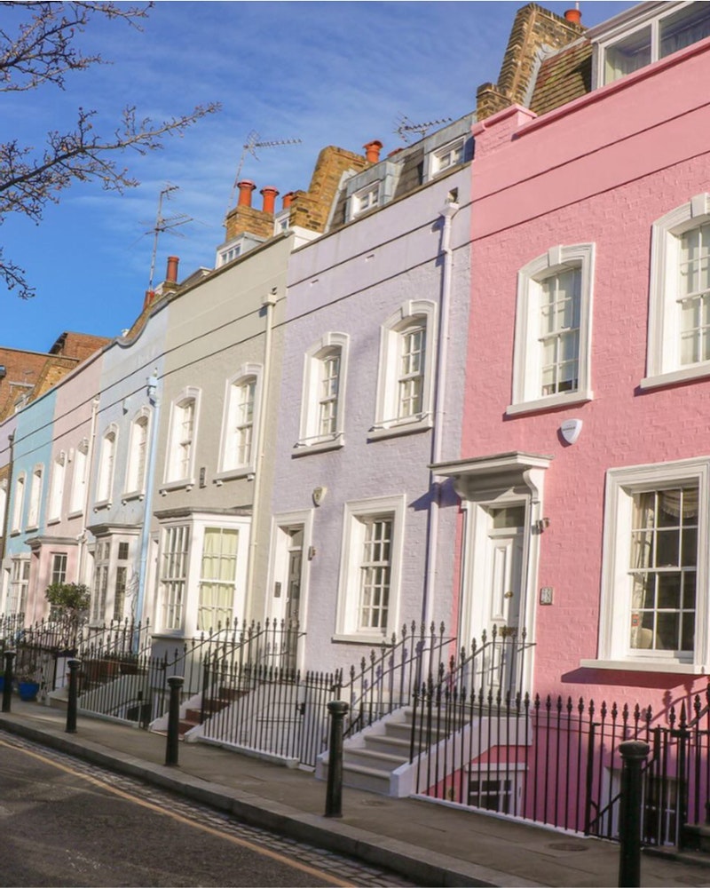 Pastel coloured houses on a street in Chelsea