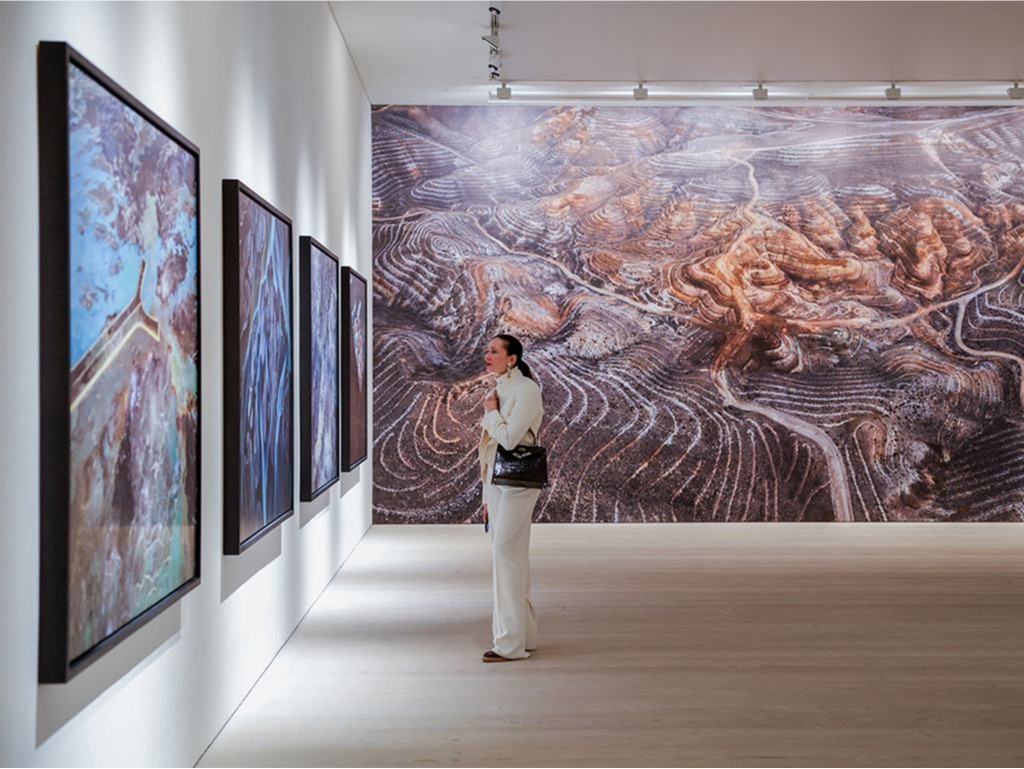 Woman looking at artwork in gallery