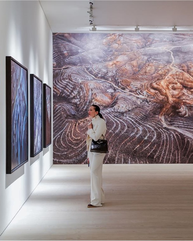 Woman looking at artwork in gallery