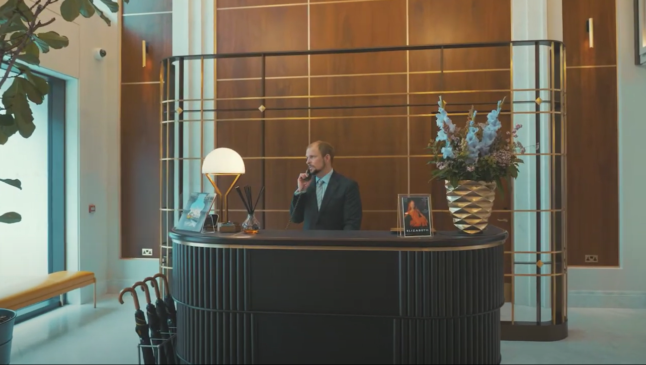 Conciege on the phone at a desk