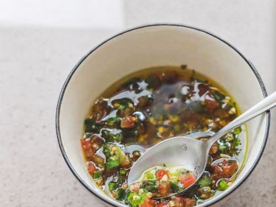 Bright, herb-infused sauce vierge in a small bowl