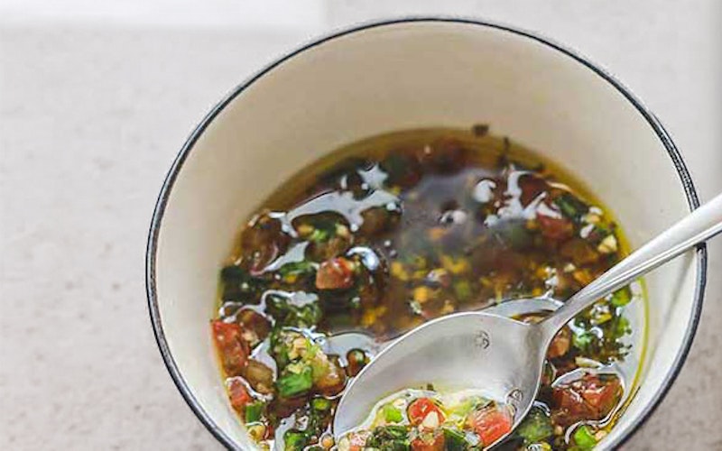 Bright, herb-infused sauce vierge in a small bowl