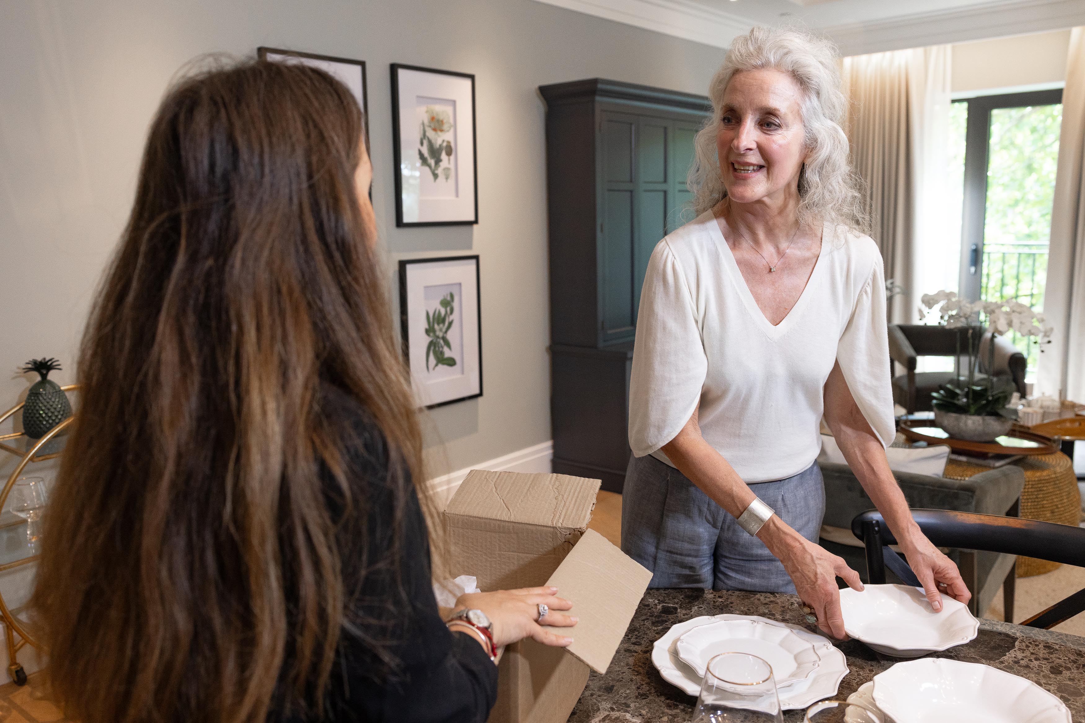Woman unpacking in retirement apartment