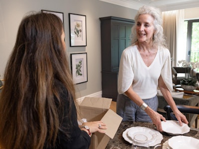 Woman unpacking in retirement apartment